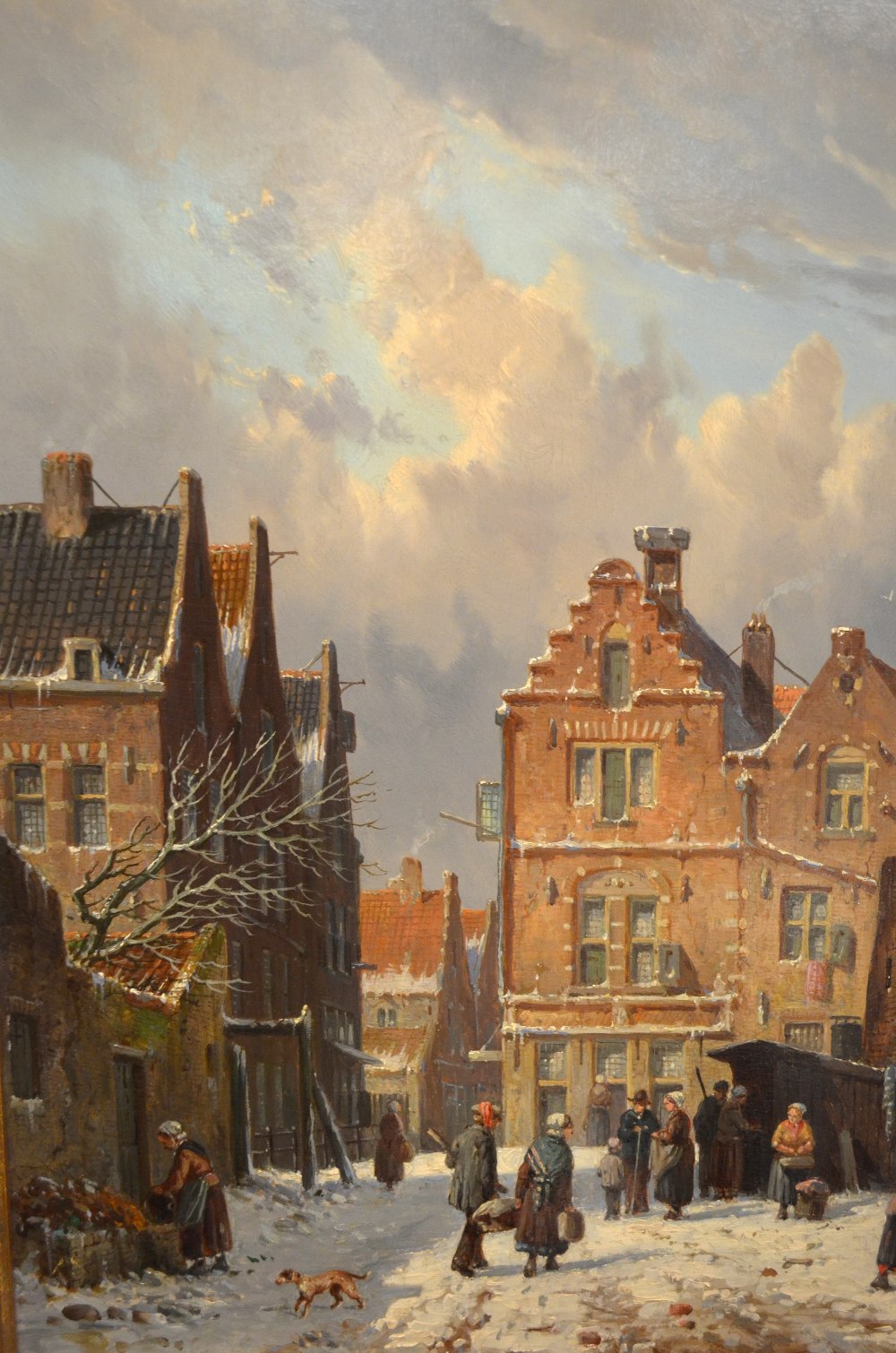 Adrianus Eversen (1818-1897) - Dutch winter town scene with figures in a snowy street, signed