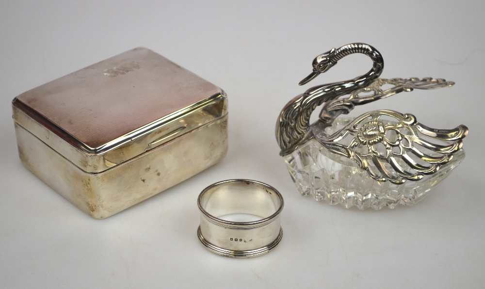 A cut glass 'swan' trinket box with silver head and wings, to/w an engine-turned cigarette box and a