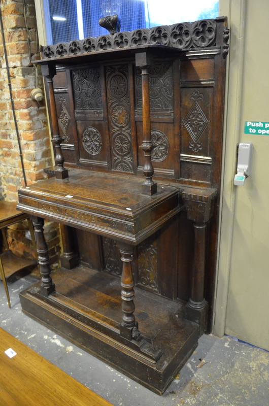 A part 17th century oak stand of 19th century construction using antique components, inscribed RA