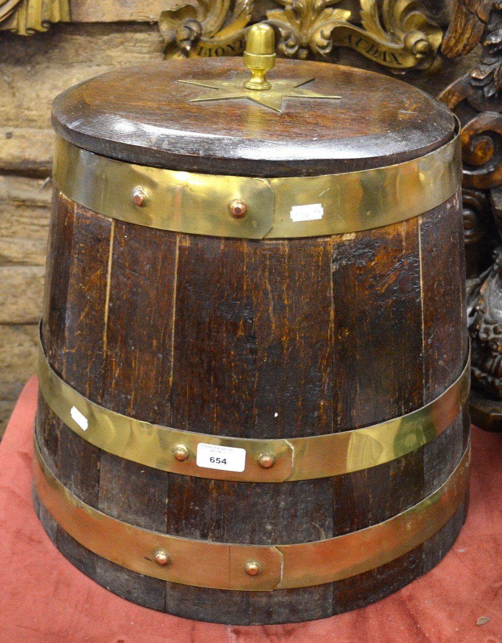 A coopered oak Naval pattern rum barrel with brass banding and acorn finial , 45 cm diameter