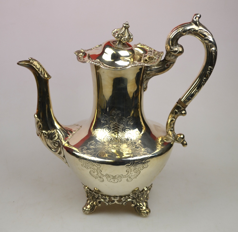 A Victorian Scottish silver baluster coffee pot with embossed and engraved decoration, maker D C