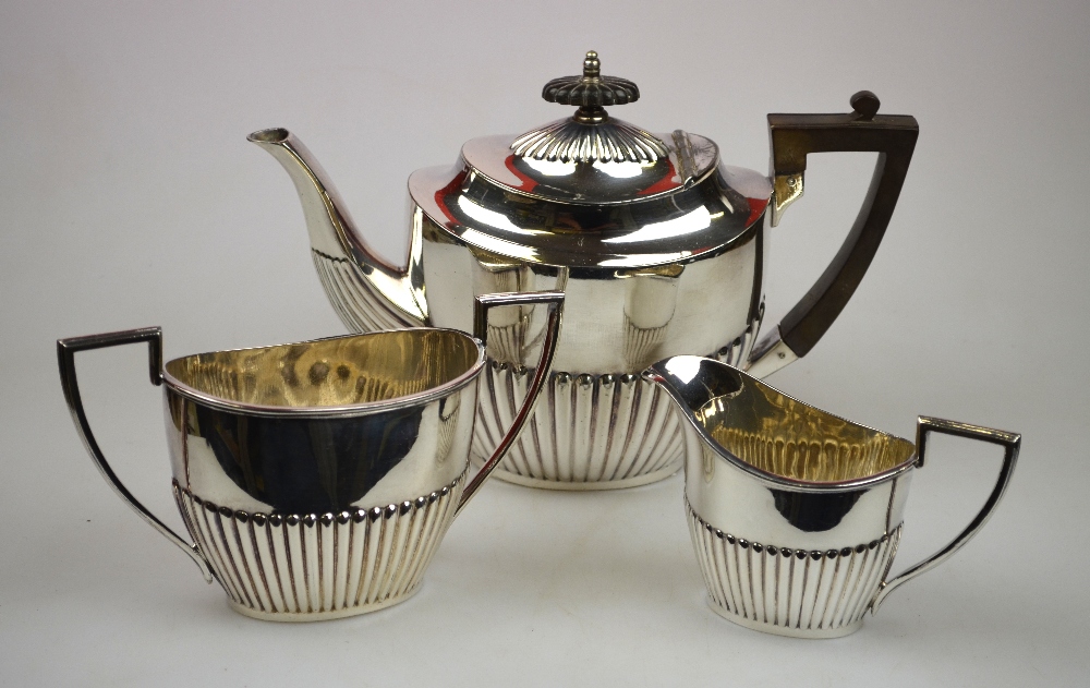 A Walker & Hall three-piece oval half-reeded tea service