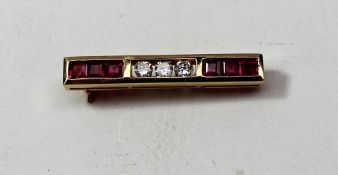 A diamond and ruby bar brooch set with six square rubies and three brilliant cut diamonds to an 18ct