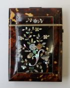 A 19th century tortoiseshell card carrying case, inlaid with mother of pearl in the form of
