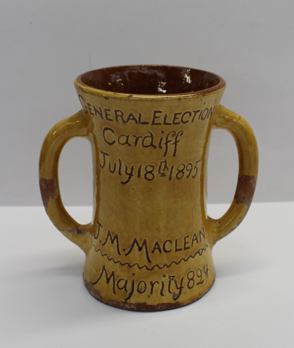 A 19th century twin handled loving cup incised "General Election Cardiff July 18th 1895, J M