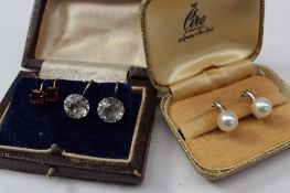 A pair of Ciro pearl earrings  on white metal clip setting and two other pairs of earrings