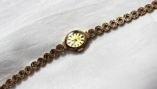 A ladies 9ct yellow gold wristwatch, the oval gilt dial with batons inscribed Rotary on a 9ct yellow