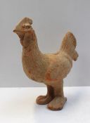 A Chinese terracotta model of a cockerel, possibly late Han Dynasty, 26 cm high
