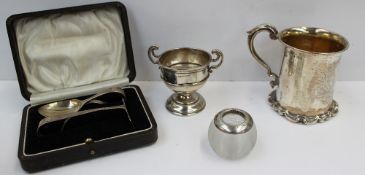 A Victorian silver christening mug of cylindrical form, the base with scrolls to a scrolling handle,