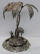 An electroplated table centrepiece in the form of an emu on an island under palm trees, 46cm high
