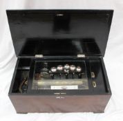 A Swiss musical box, the hinged cross banded top enclosing a glass panel and 28.5cm cylinder,