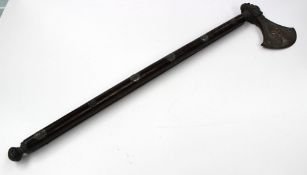 An oriental axe with steel head and shaft, the handle encased in hardwood with white metal studs