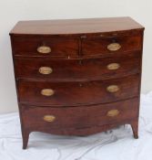 A George III mahogany chest, the bowed top above two short and three long drawers on splayed bracket
