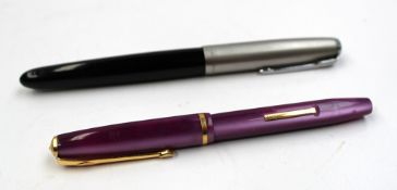 A Conway Stewart 570 amethyst coloured fountain pen with a 14ct gold nib, together with a parker
