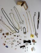 Assorted costume jewellery including a tennis bracelet, earrings, necklaces, faux pearls,