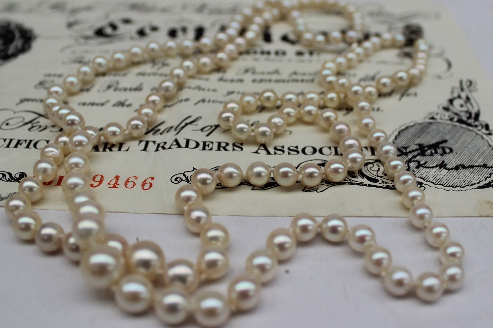 A two strand cultured pearl necklace with graduated pearls to white metal clasp marked 9ct