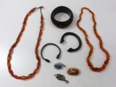 An amber necklace with irregular beads together with a hardstone bead necklace, bracelets and