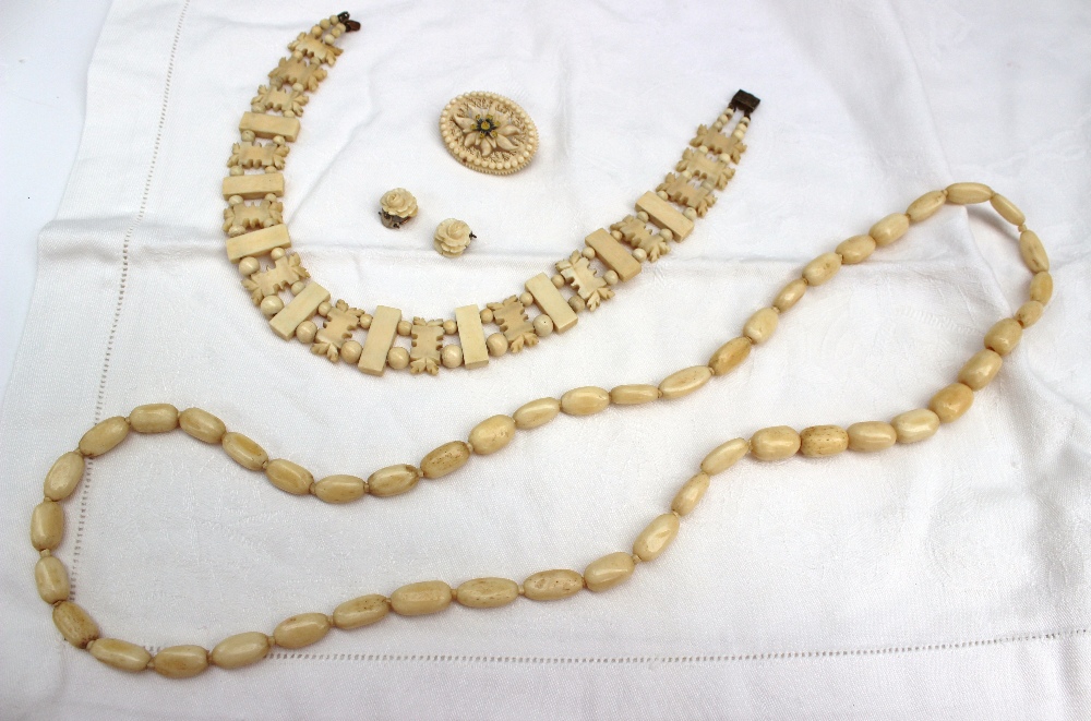 A bone bead necklace together with a bone brooch inscribed "Grossglockner 3798m" floral earrings and