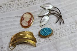 A 9ct yellow gold wave form brooch approximately 6 grams together with a turquoise brooch, a cameo