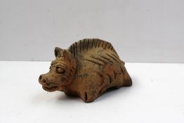 A Chinese hollow cast terracotta figure of a stylised zodiac tiger, arched back with stub tail type,