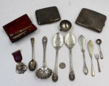 A late Victorian silver sifting spoon, together with a matching pair of silver spoons, Sheffield,