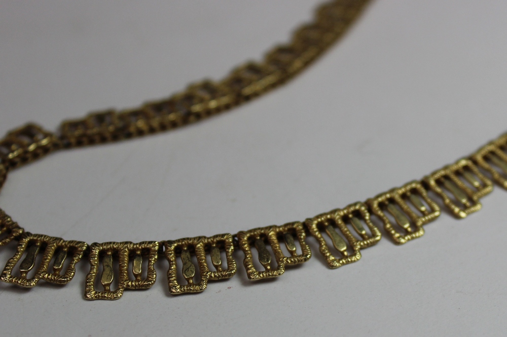 A 9ct yellow gold necklace with a geometric fringe design approximately 21 grams