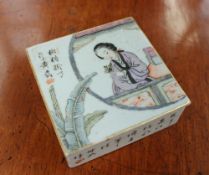 A Chinese porcelain box and cover of square form, the cover painted with a female figure in a