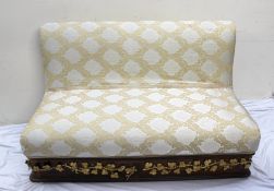 A 19th century continental upholstered settee, the sweeping back above a pad seat, the base