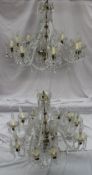 A pair of ten branch lustre drop chandeliers with twisted arms, glass pans and crystal drops, 73