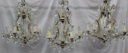 A set of three five branch lustre drop chandeliers with C shaped uprights and crystal drops, 58 cm