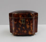 A 19th century tortoiseshell, ivory and bone veneered tea caddy, of shaped octagonal lobed form,