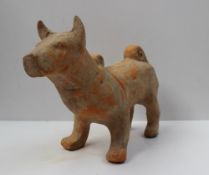 A Chinese terracotta model of a dog of large size, possibly Han Dynasty, 25 cm high