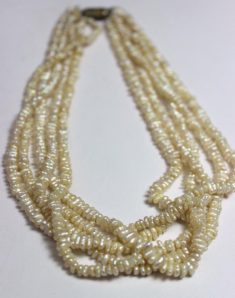 A five strand freshwater pearl necklace to a barrel clasp