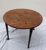 A 19th century mahogany gateleg dining table, the oval top with drop flaps on tapering legs and
