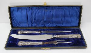 A Edward VII silver handled kings pattern carving set, comprising carving knife, fork and steel,