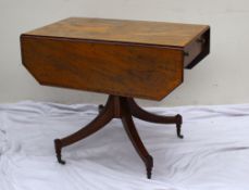 A Regency mahogany sofa table, the rectangular cross banded top with drop flaps and a drawer with