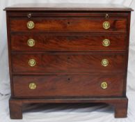 A George III mahogany bachelors chest, the rectangular top above a brushing slide and four long