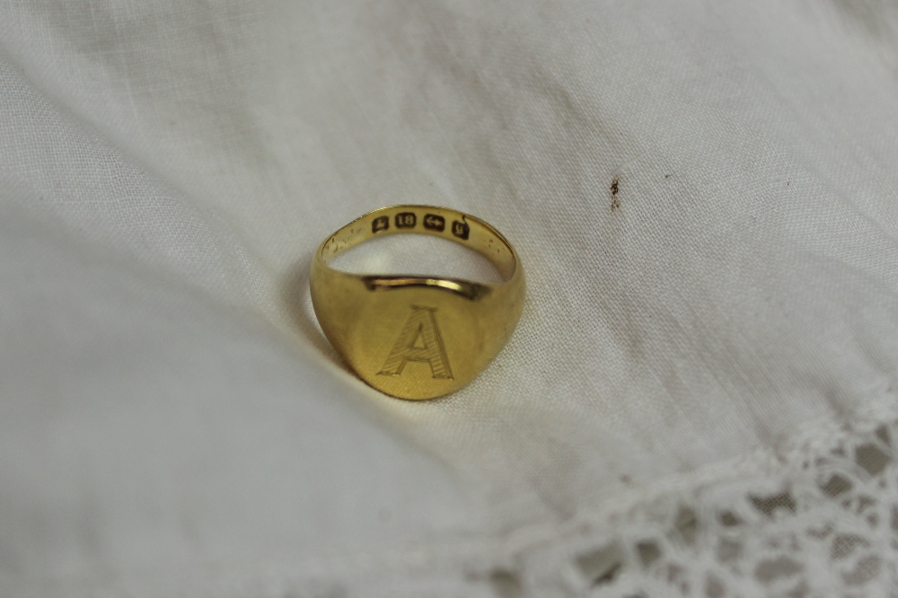 An 18ct yellow gold signet ring initialled "A", approximately 5 grams
