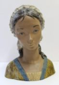 A Lladro stoneware portrait bust of a young lady in a cloth hat, 35cm high