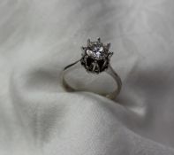 A Solitaire diamond ring the brilliant cut diamond approximately  0.75 of a carat to an 18ct white
