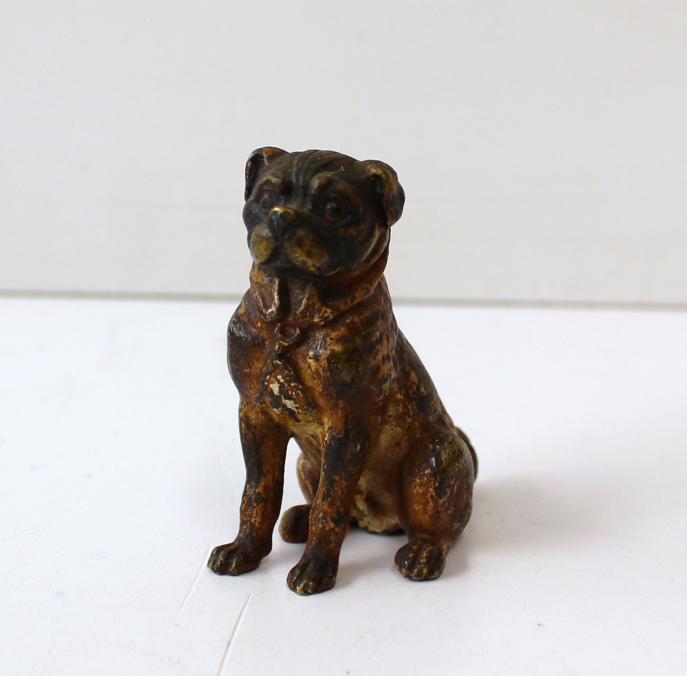A cold painted bronze model of a seated pug, 6.5 cm high, together with a bronze model of a Hare,