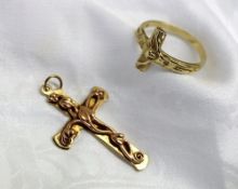 A yellow metal ring in the form of Christ on the cross marked 14k approximately 4 grams together