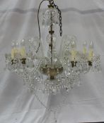 A pair of eight branch lustre drop chandeliers with twisted arms, glass pans and crystal drops, 64
