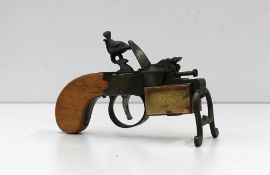 A Dunhill tinder pistol, in the form of a flintlock pistol