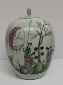 A Chinese porcelain jar and cover, painted with oriental figures in a landscape, 34cm high