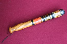 A Victorian truncheon painted with a crown and shield, marked VR to a black ground with a turned
