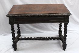A 19th century oak side table, the rectangular top above a pair of drawers with lion head handles on