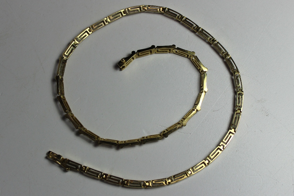 A yellow metal rectangular link necklace marked 585, approximately 15 grams