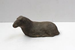 A Chinese grey terracotta figurine of a seated ram, 6.5 cm high, possibly early western Han Dynasty