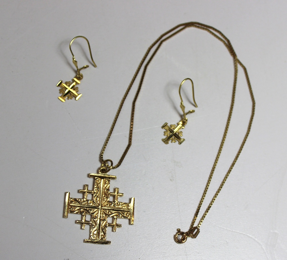 A yellow metal cross inscribed Jerusalem, 18k, with matching earrings, approximately 7 grams